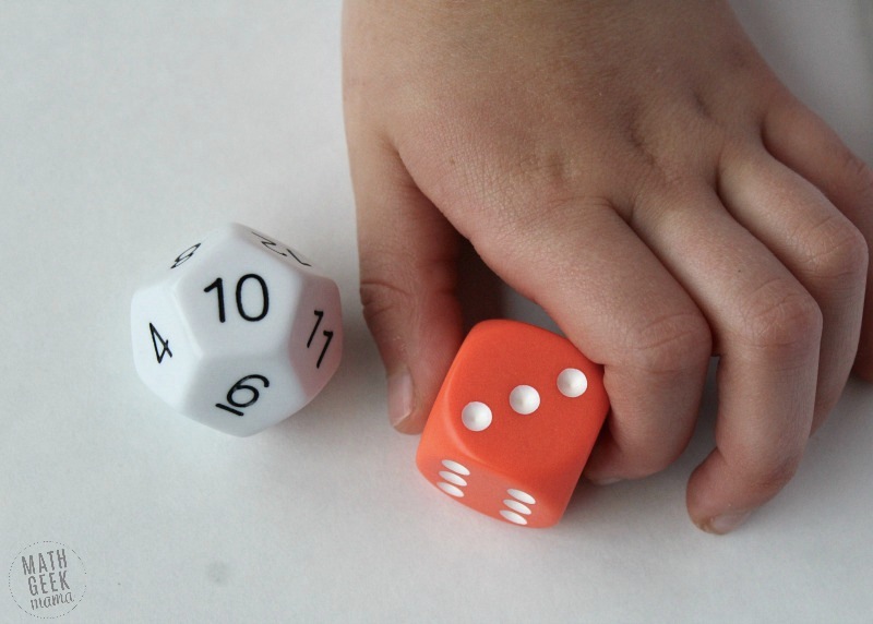 Kid playing with math dice