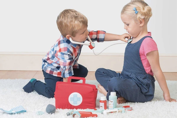 Kids dressed as doctor and patient