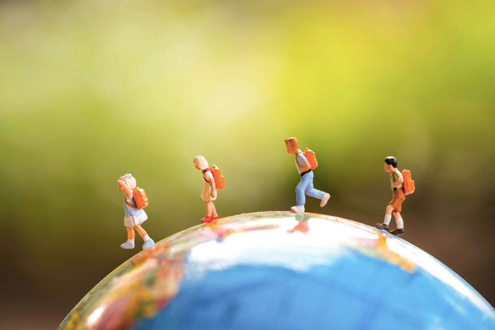 Kids walking on a globe