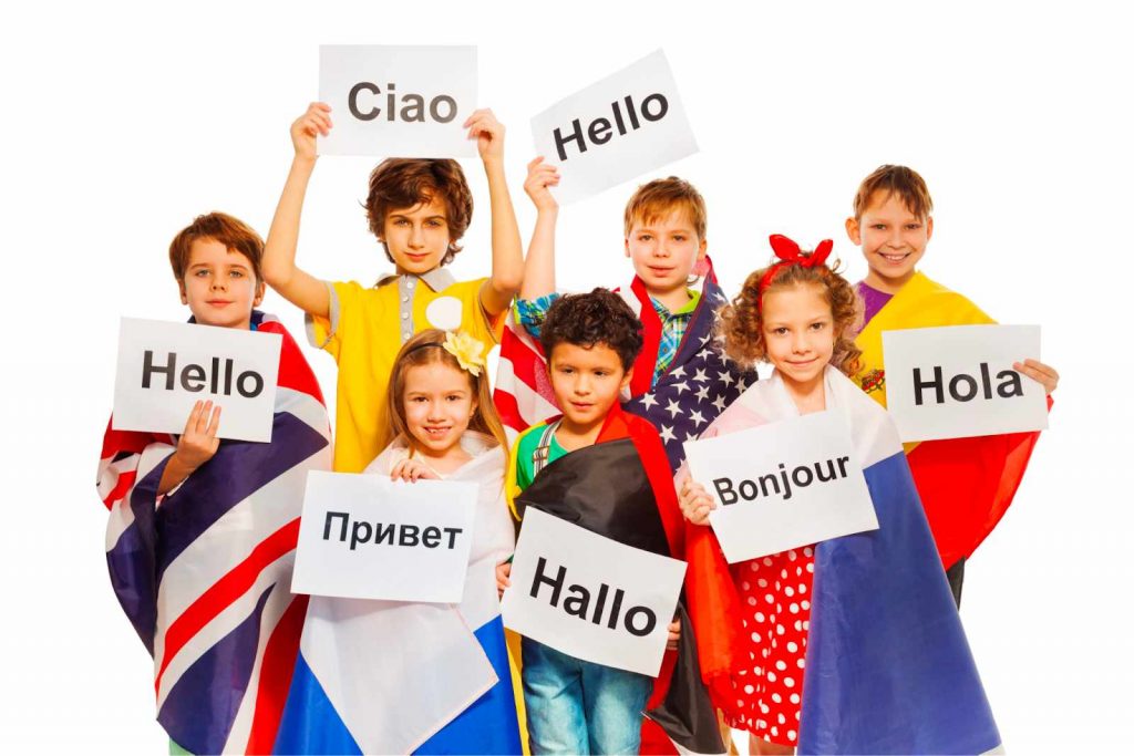 Kids holding papers with hello written in different language