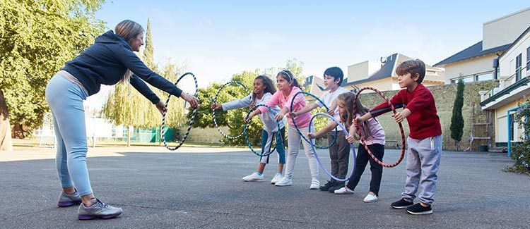 Kids practicing hula hoop