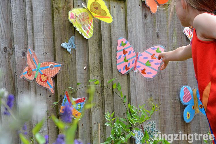 Kid making a butterfly garden