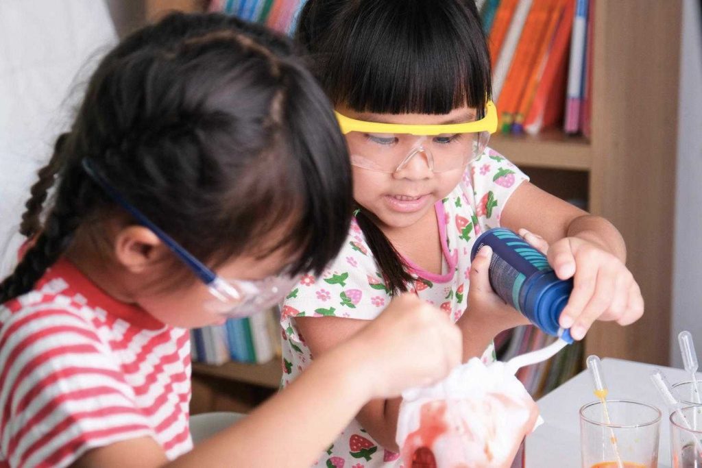 Kids performing science experiment