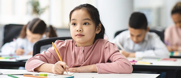 kid taking notes