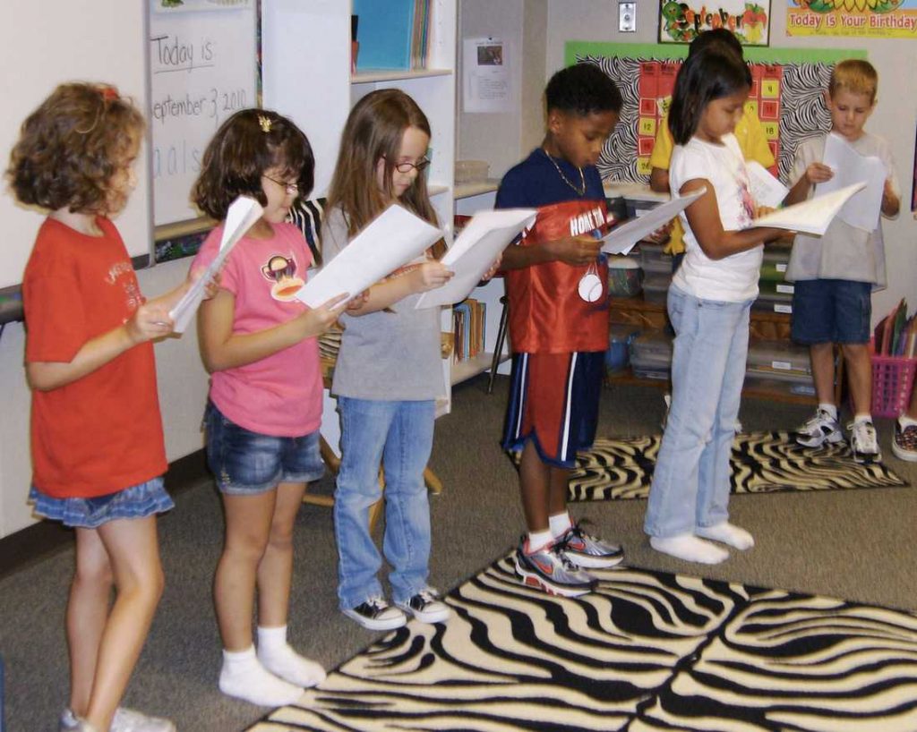 Kids reading in a readers theater