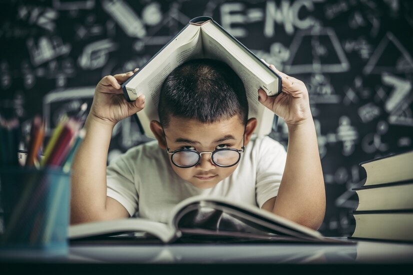 A boy struggling in reading book