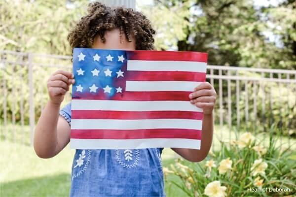 Kid holding a US flag