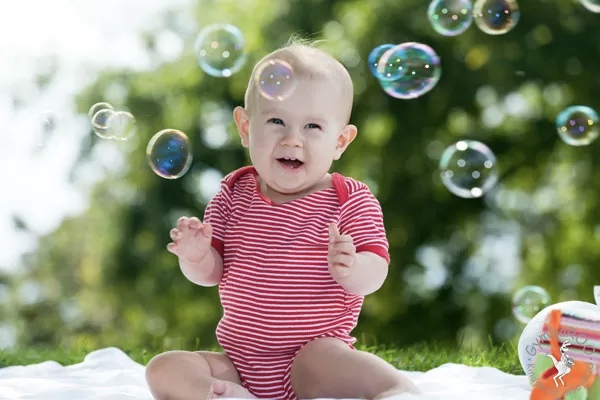 Baby with bubbles around