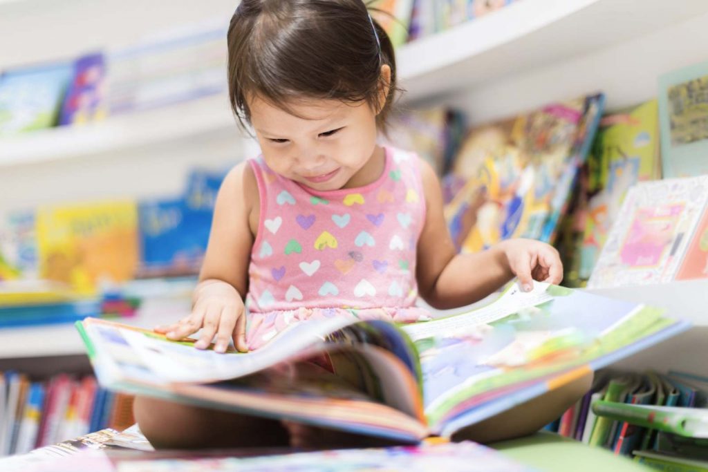 Kid reading a storybook