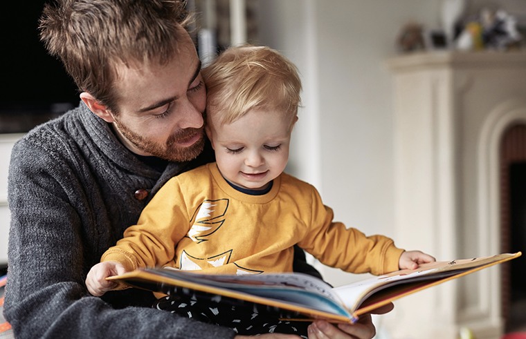 Father reading story to child