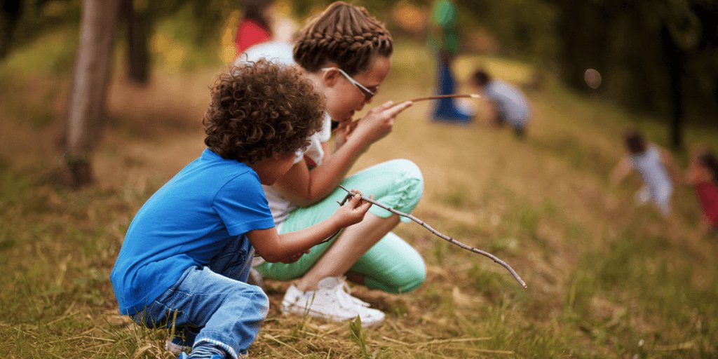 Kids engaging in nature scavenger hunt