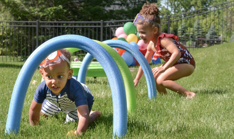 Kids playing obstacle course