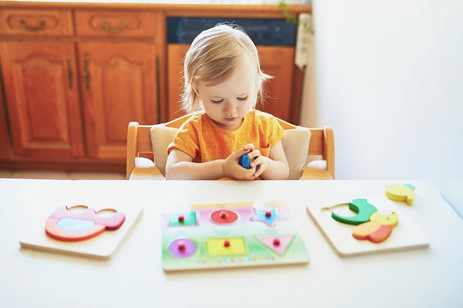 Toddler playing with puzzle