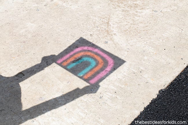 Kid using object to cast shadow