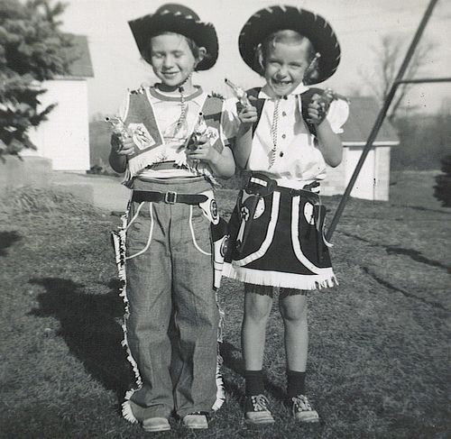 Image of a two kids dressed as cowboy and cowgirl for Halloween