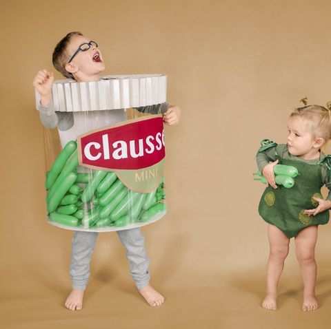 Image of 2 kids dressed as pickle jar and pickle for Halloween