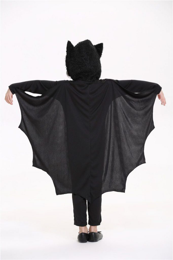 Image of kid in a vampire bat costume for Halloween
