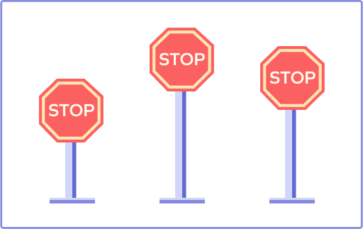 Comparing the heights of the STOP signs